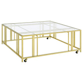 Orleans Furniture - Coaster - Adri Square Glass Top Coffee Table with Casters Matte Brass - 710188