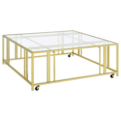 Orleans Furniture - Coaster - Adri Square Glass Top Coffee Table with Casters Matte Brass - 710188