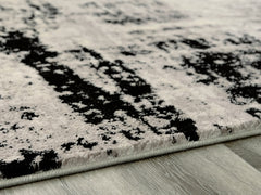Orleans Furniture - Ashley Furniture - Zekeman Rug - 7'10" x 10' Rug / Black/Cream/Gray - R404921