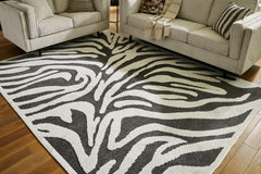 Orleans Furniture - Ashley Furniture - Thomwith Rug - 8' x 10'2" Washable Rug / Black/Ivory - R406291