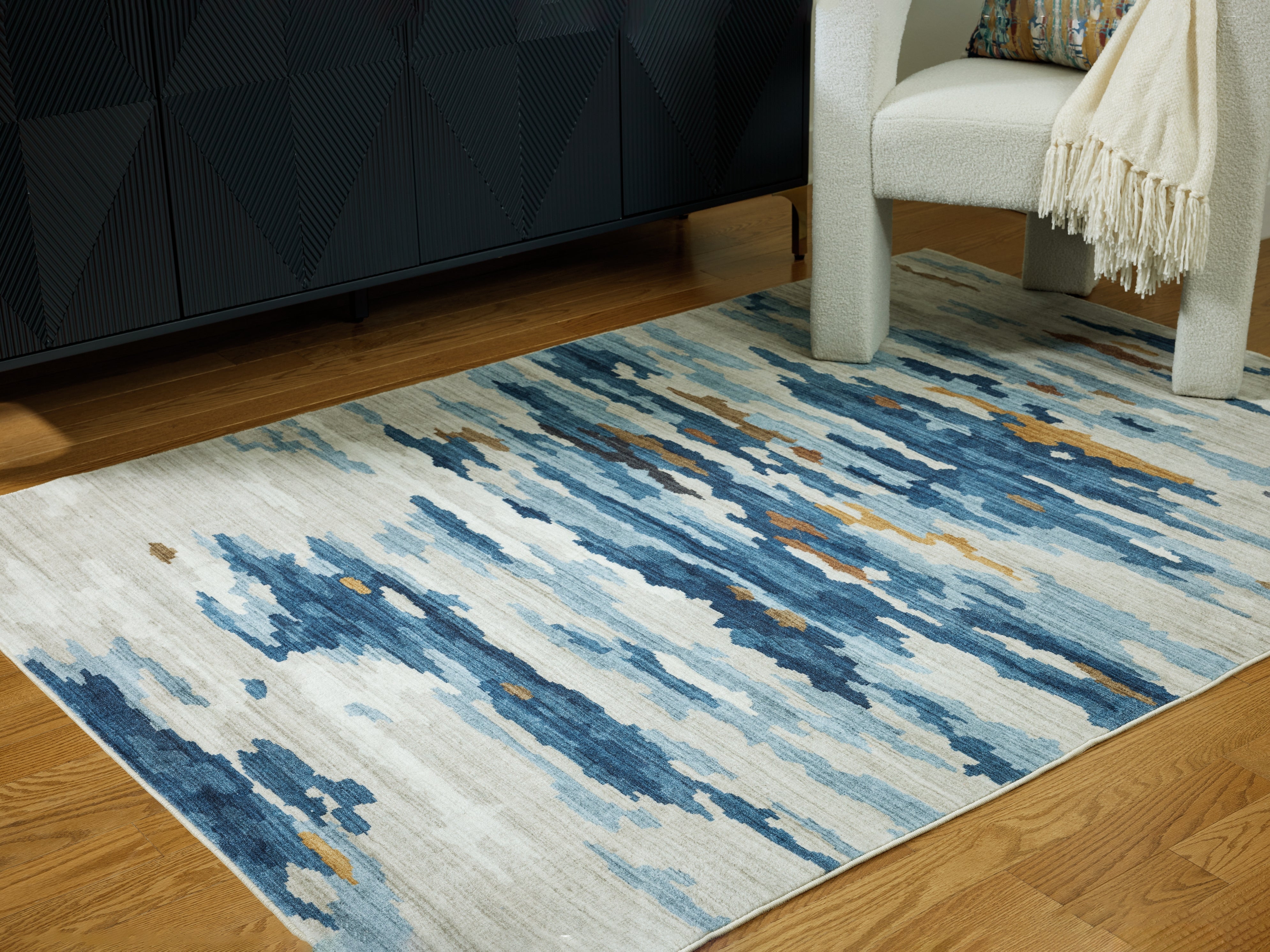 Orleans Furniture - Ashley Furniture - Vinlett Rug - 5' x 7' Washable Rug / Cream/Blue/Brown - R407042
