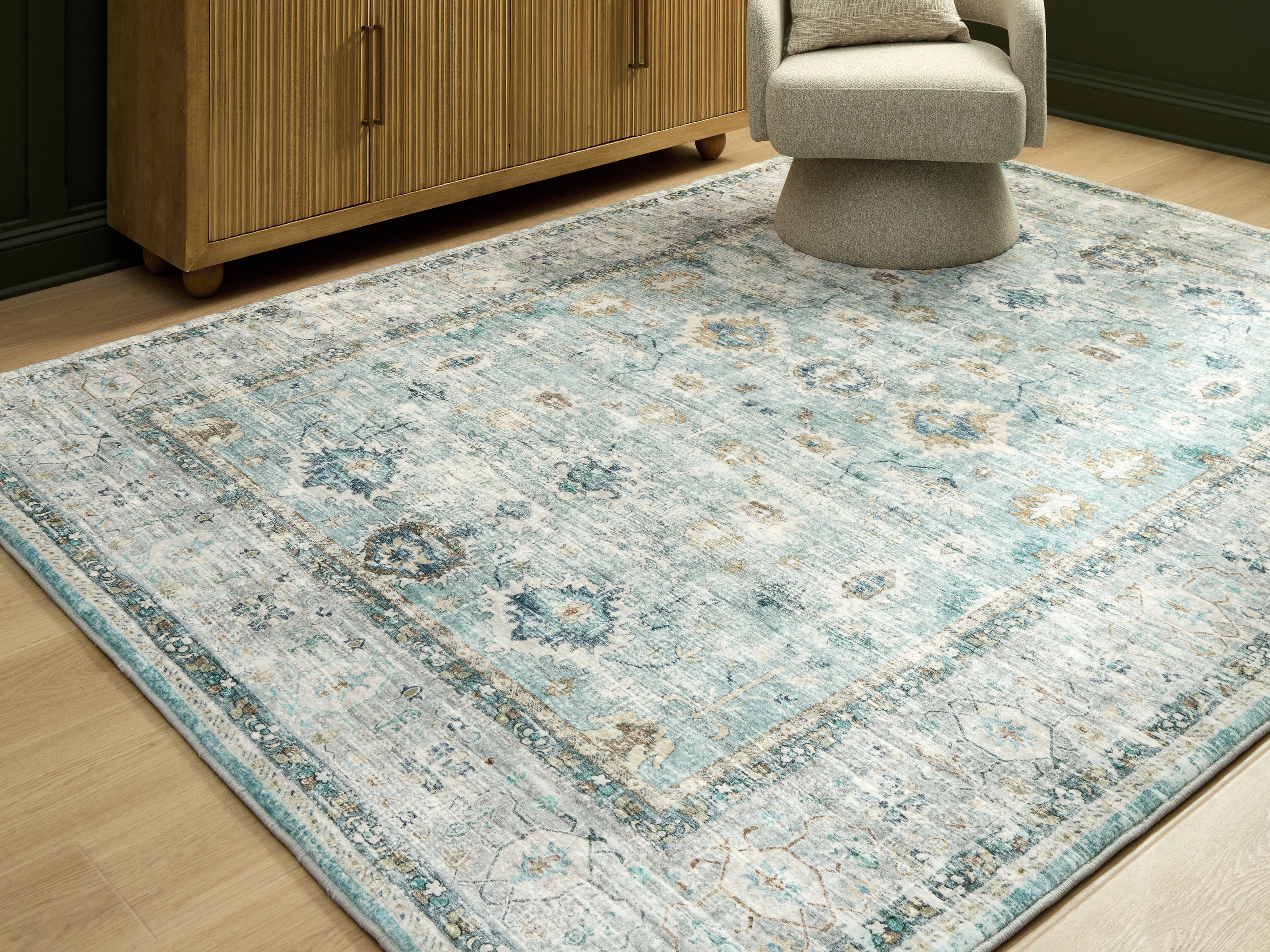 Orleans Furniture - Ashley Furniture - Ladstoney Rug - 7'6" x 9'6" Area Rug / Teal/Beige/Ochre - R407501
