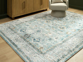 Orleans Furniture - Ashley Furniture - Ladstoney Rug - 7'6" x 9'6" Area Rug / Teal/Beige/Ochre - R407501