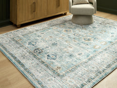 Orleans Furniture - Ashley Furniture - Ladstoney Rug - 7'6" x 9'6" Area Rug / Teal/Beige/Ochre - R407501