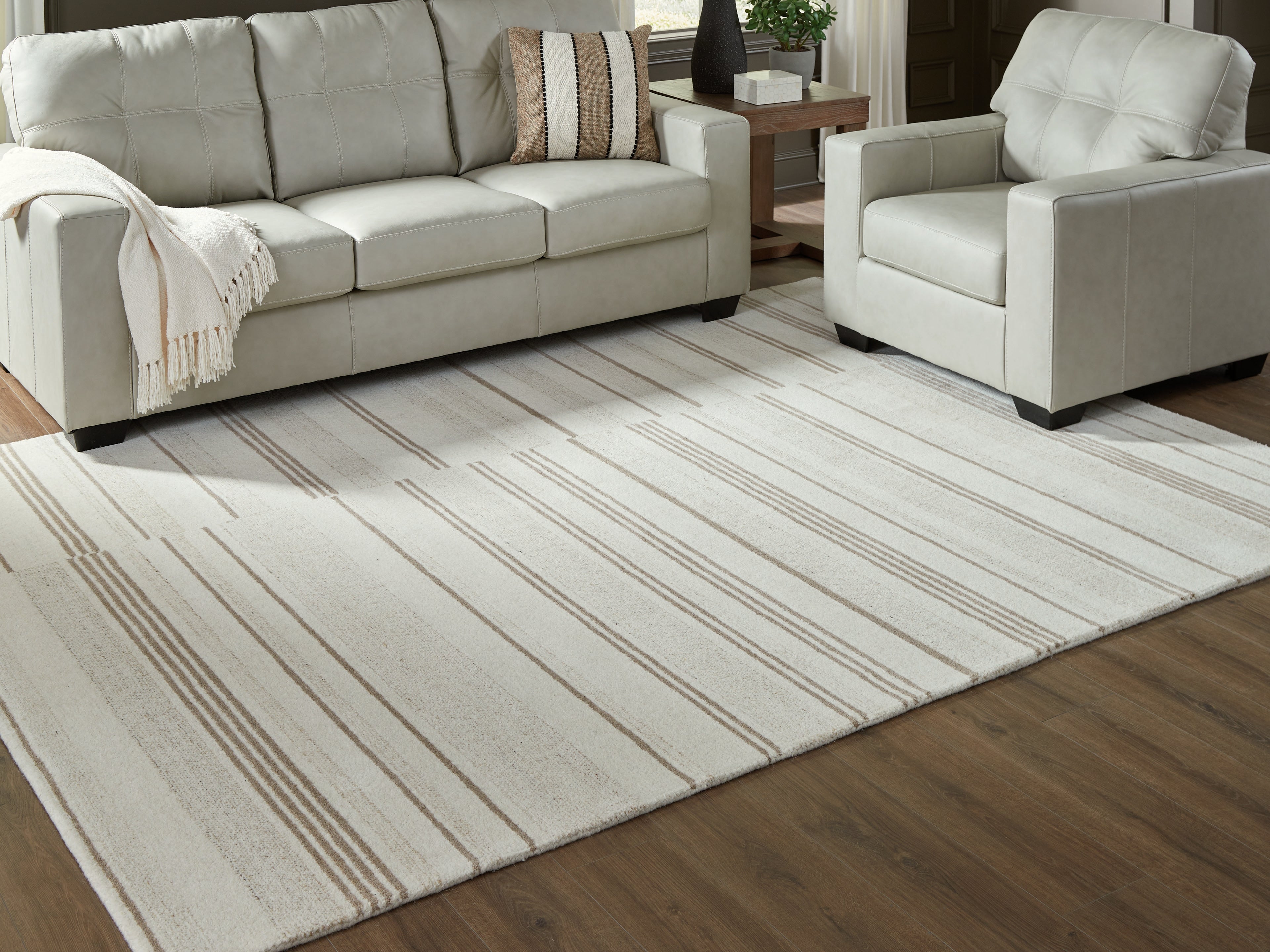 Orleans Furniture - Ashley Furniture - Gadence Rug - 5' x 7' Area Rug / Ivory/Tan - R407642