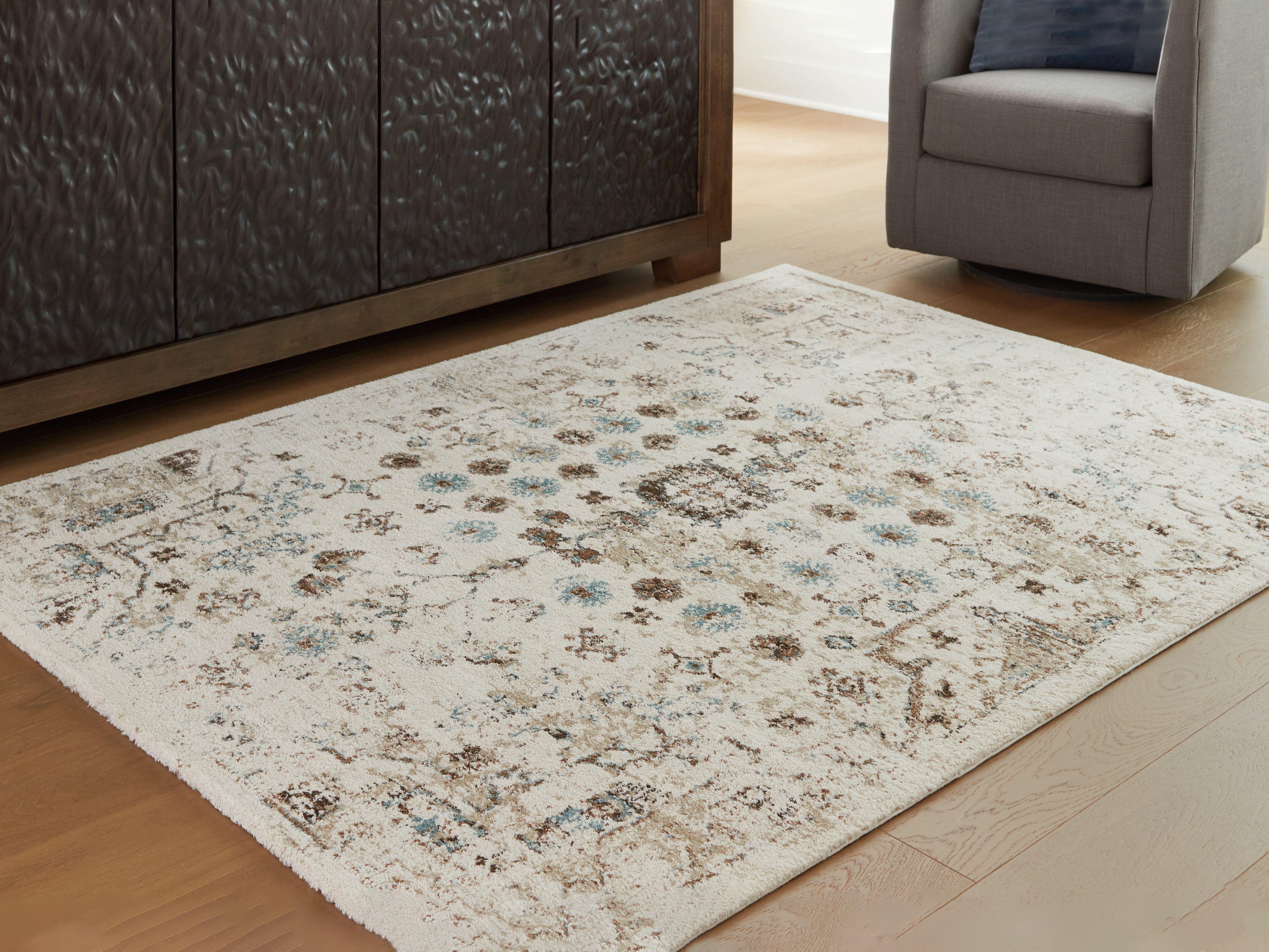 Orleans Furniture - Ashley Furniture - Jossler Rug - 5' x 7' Rug / Ivory/Brown/Teal - R407072