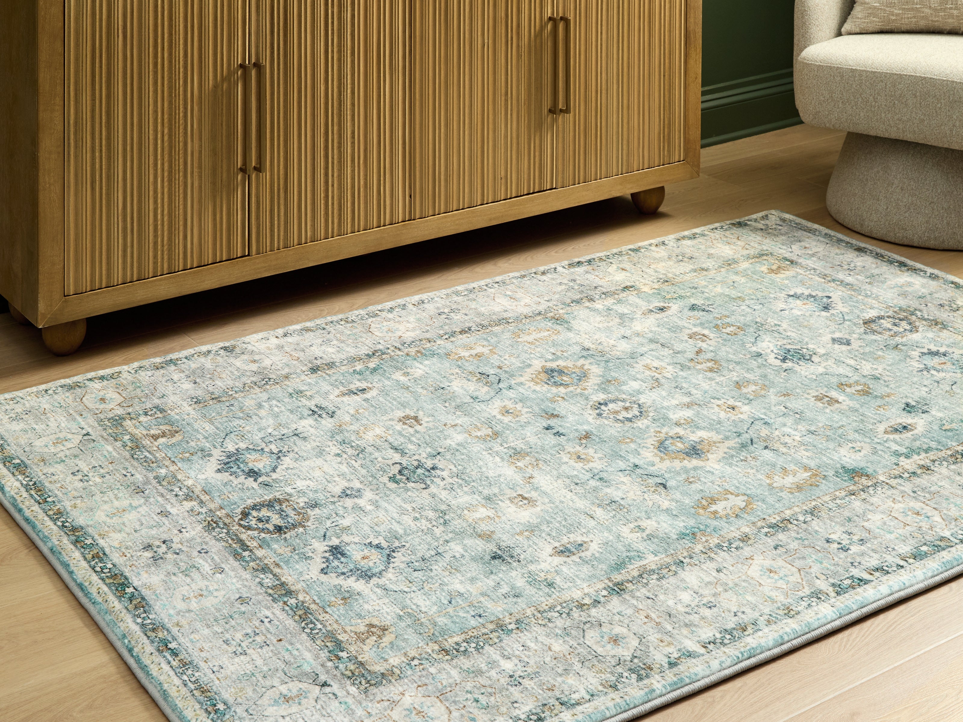Orleans Furniture - Ashley Furniture - Ladstoney Rug - 5' x 7' Area Rug / Teal/Beige/Ochre - R407502