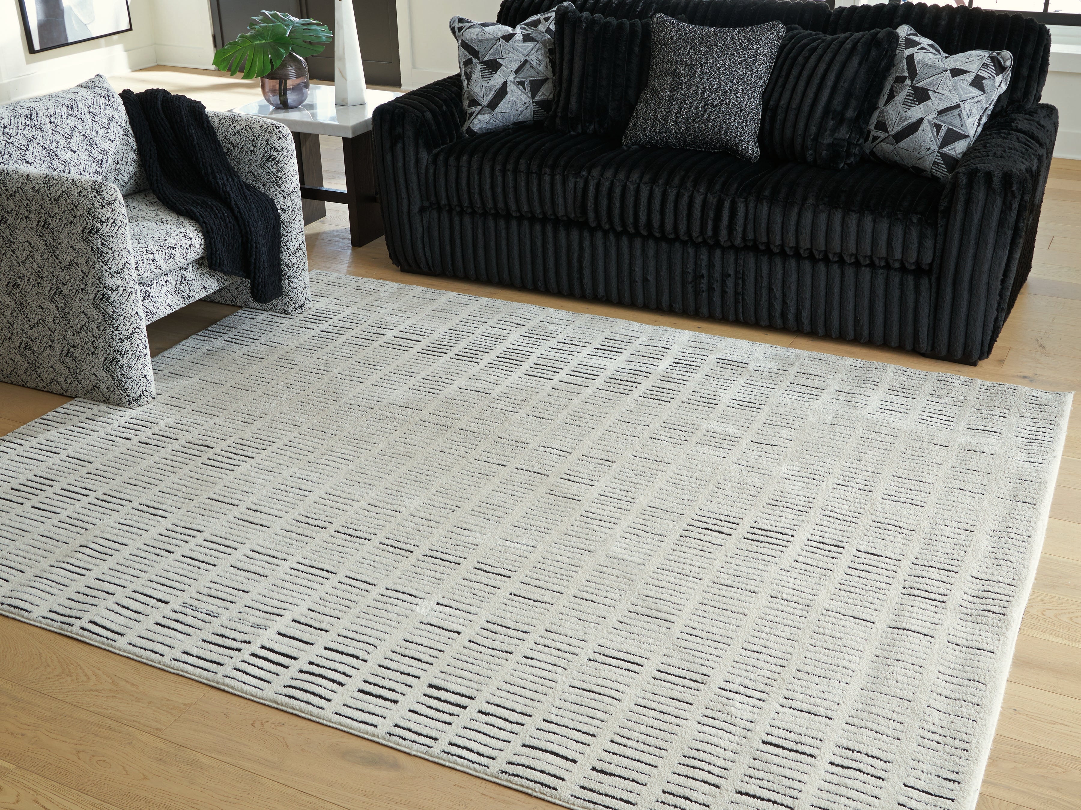 Orleans Furniture - Ashley Furniture - Turinwith Rug - 7'10" x 9'10" Area Rug / Ivory/Black - R407551