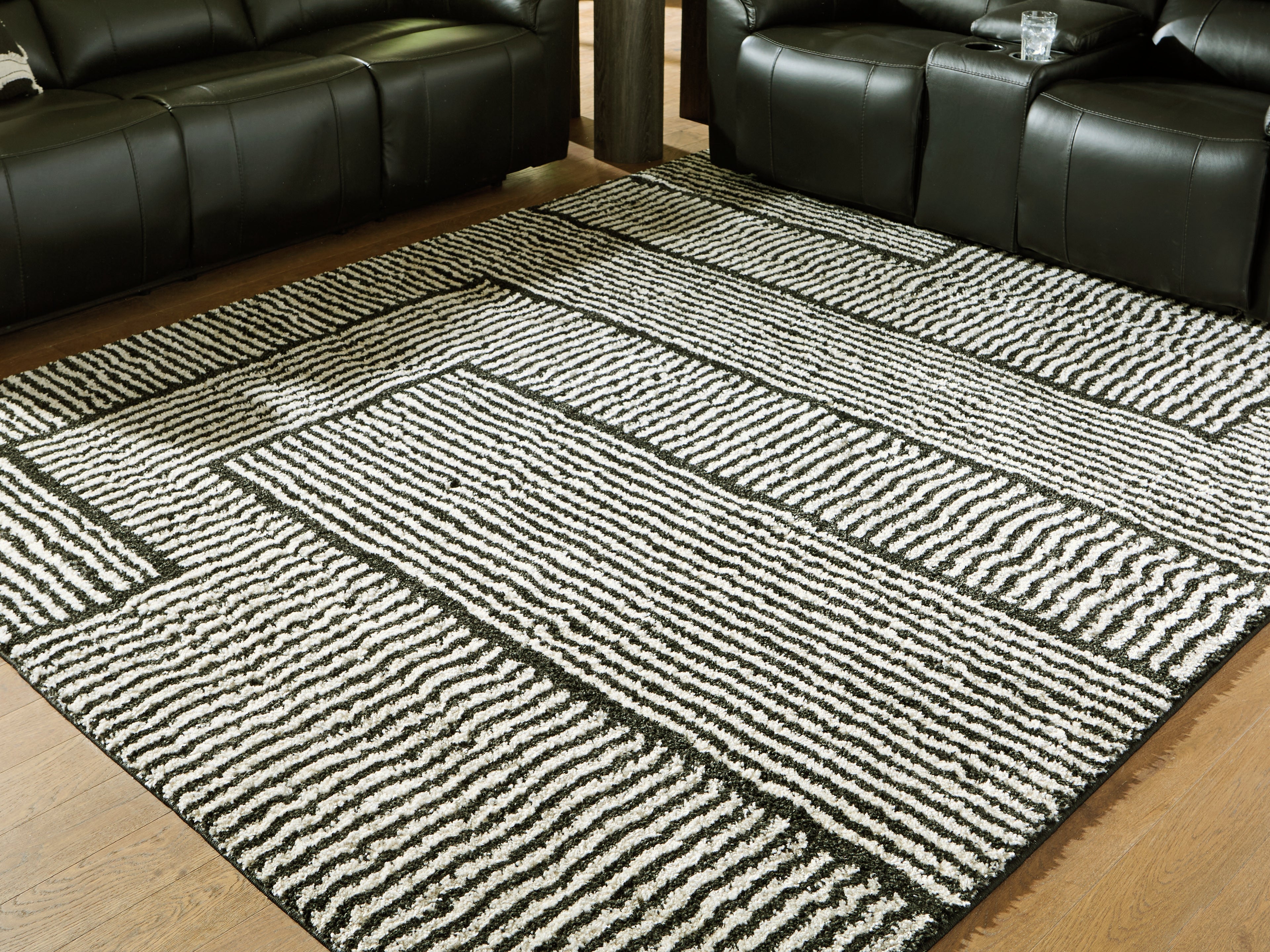 Orleans Furniture - Ashley Furniture - Kurtmen Rug - 7'10" x 9'10" Area Rug / Black/Ivory - R407591