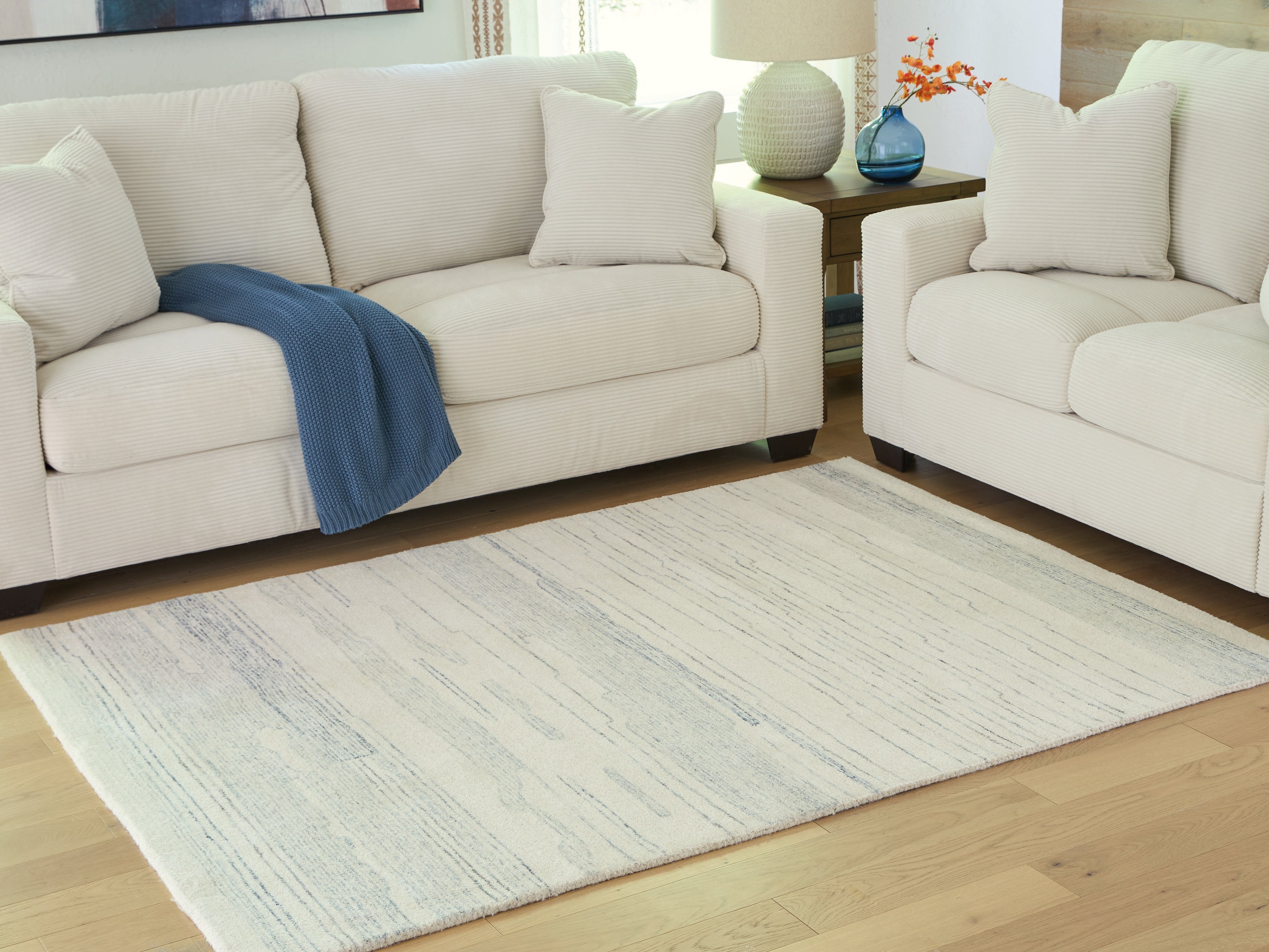 Orleans Furniture - Ashley Furniture - Genemost Rug - 5' x 7' Area Rug / Ivory/Blue - R407842
